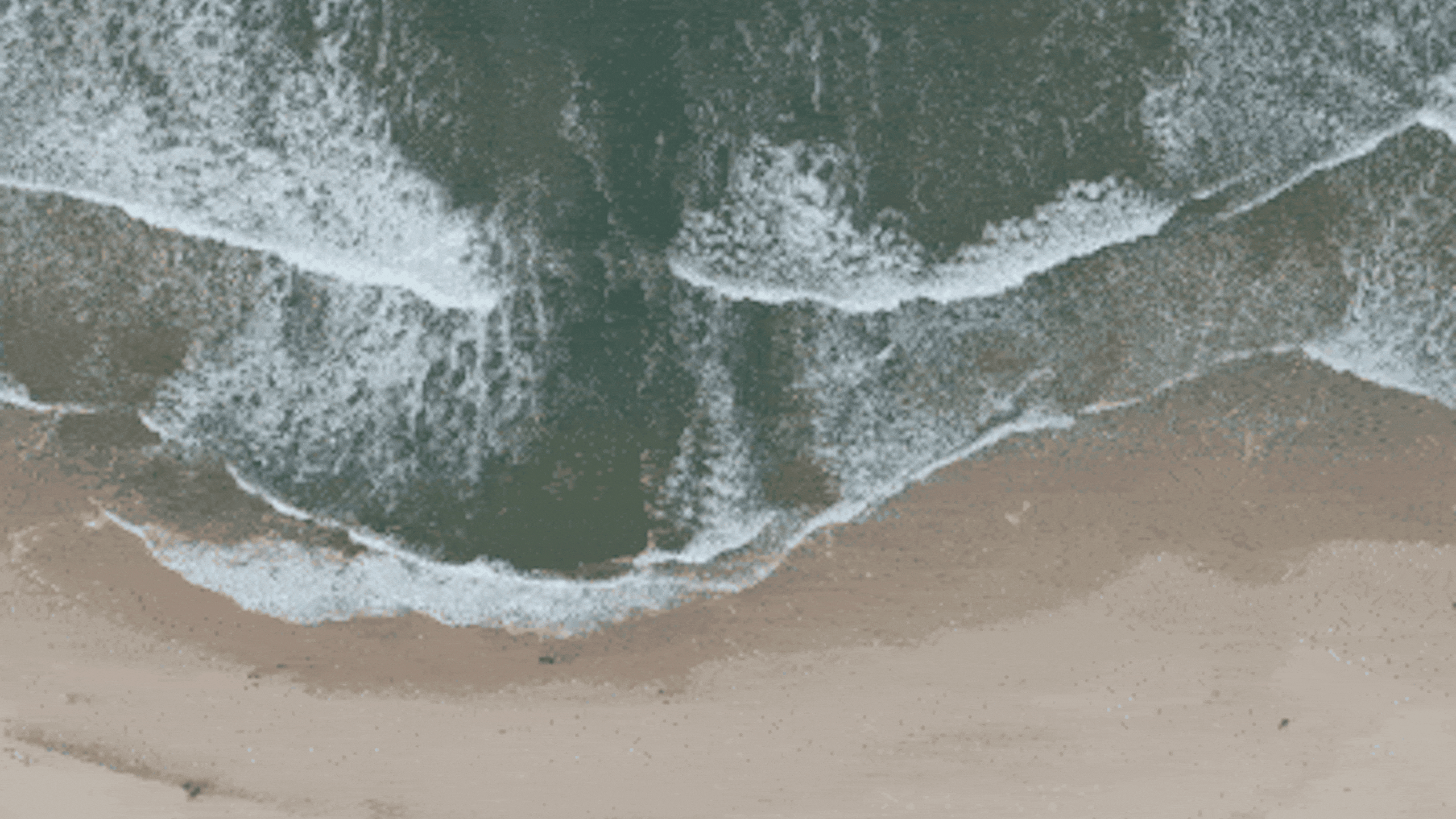 Aerial shot of a beach with waves