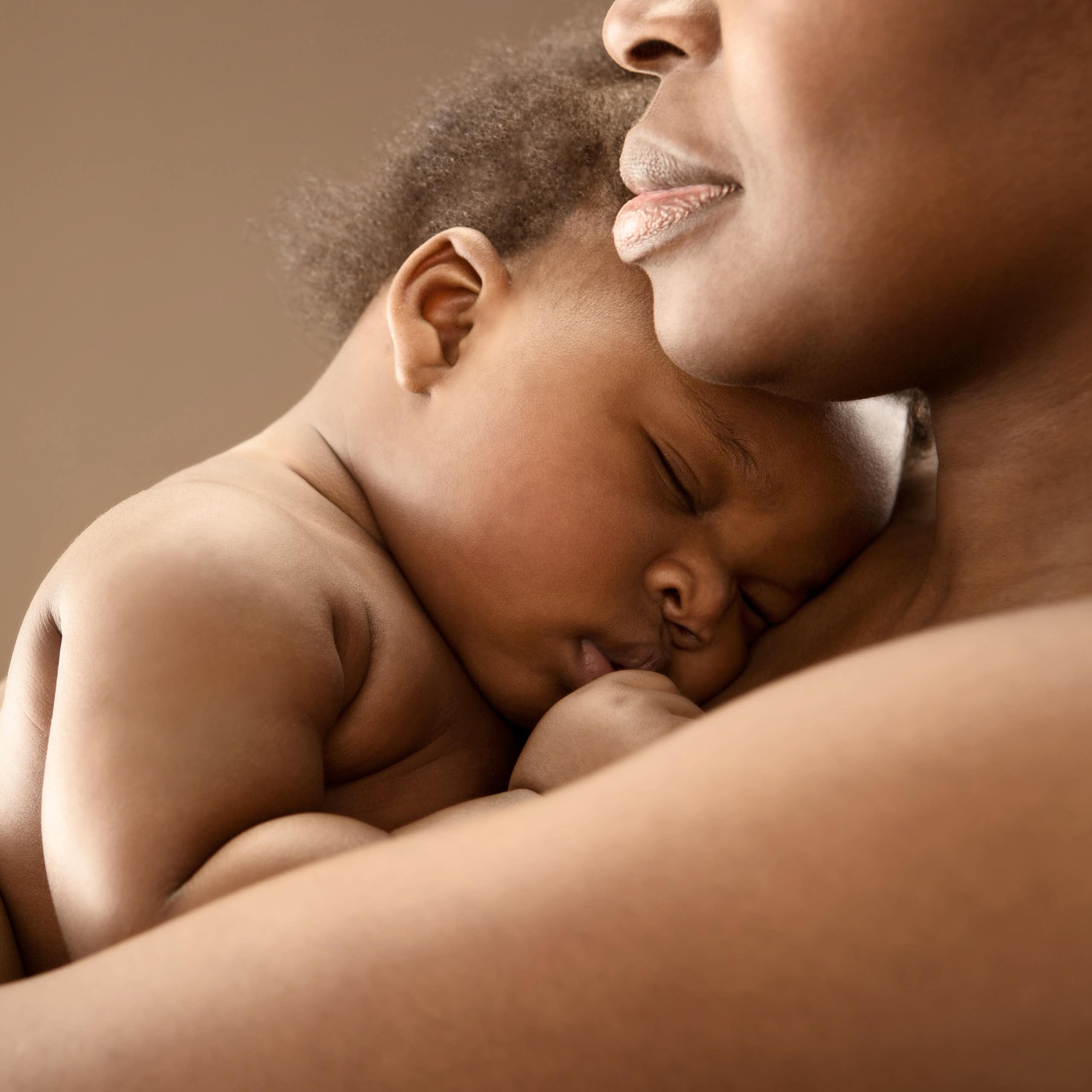 Woman holding a sleeping baby