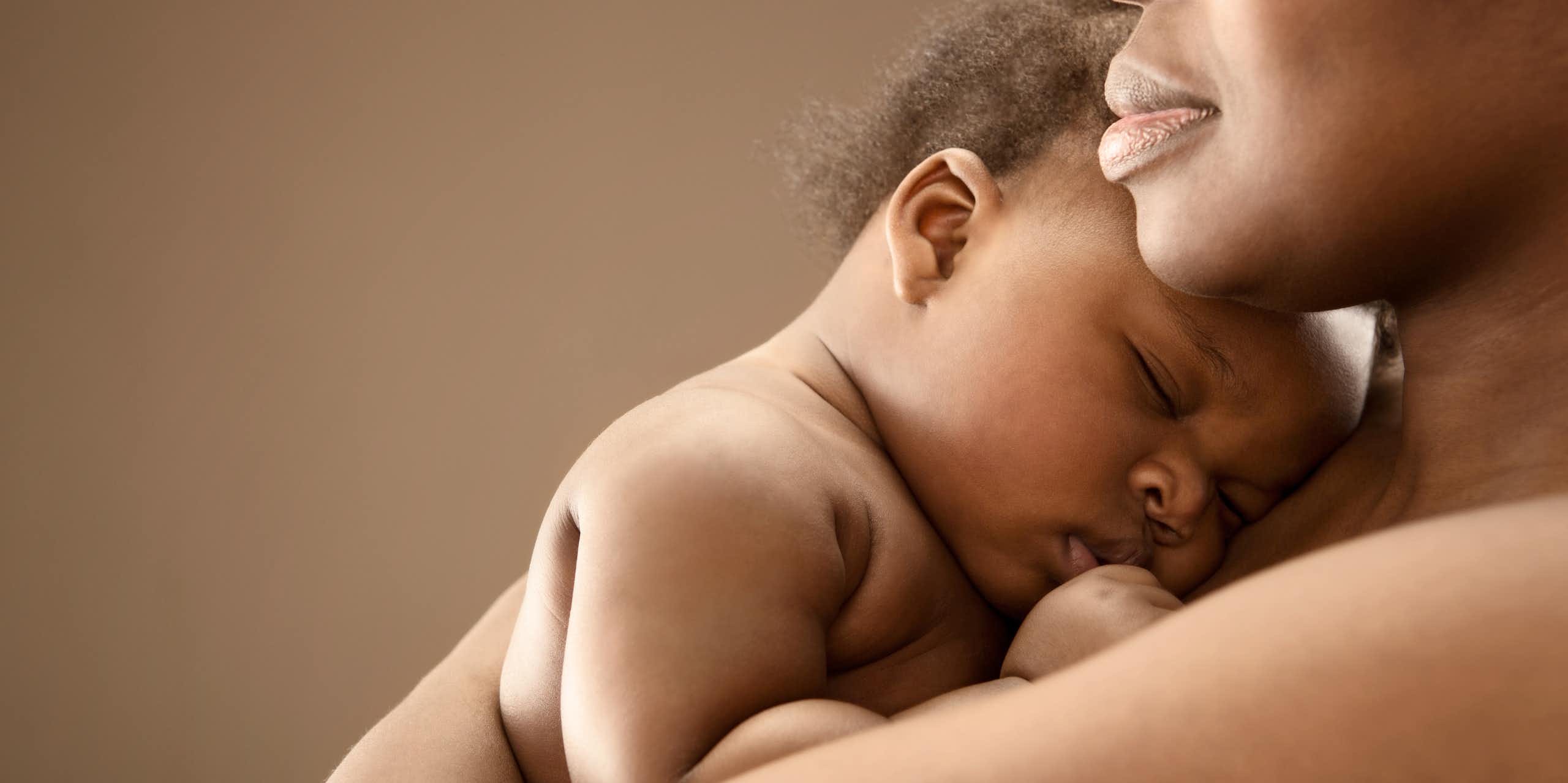Woman holding a sleeping baby