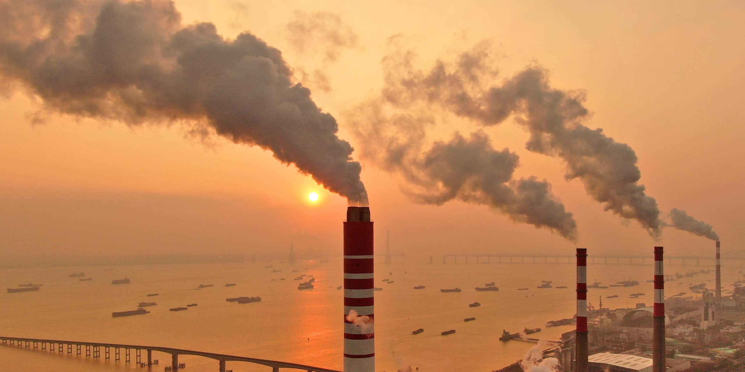 smoke billows from chimneys