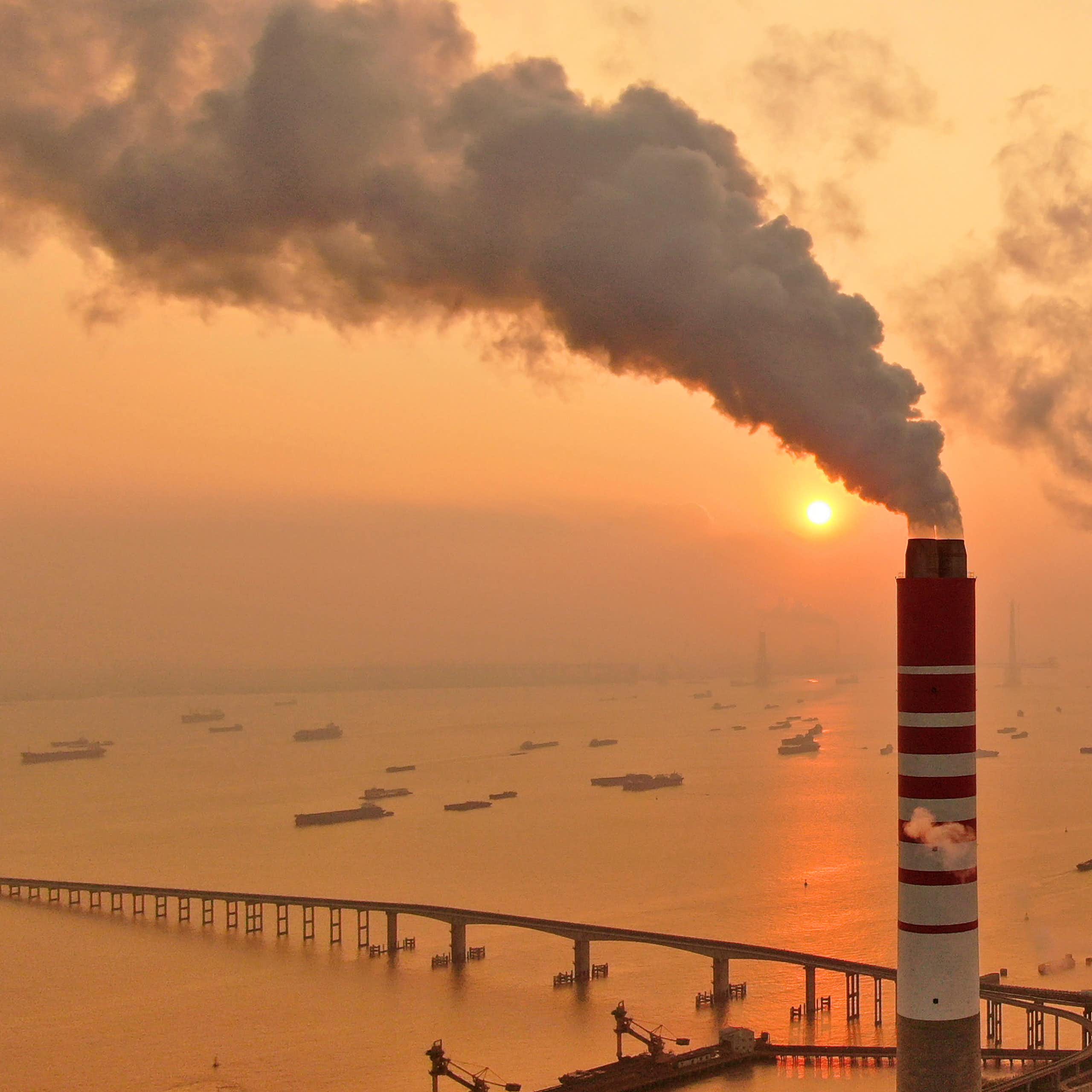 smoke billows from chimneys