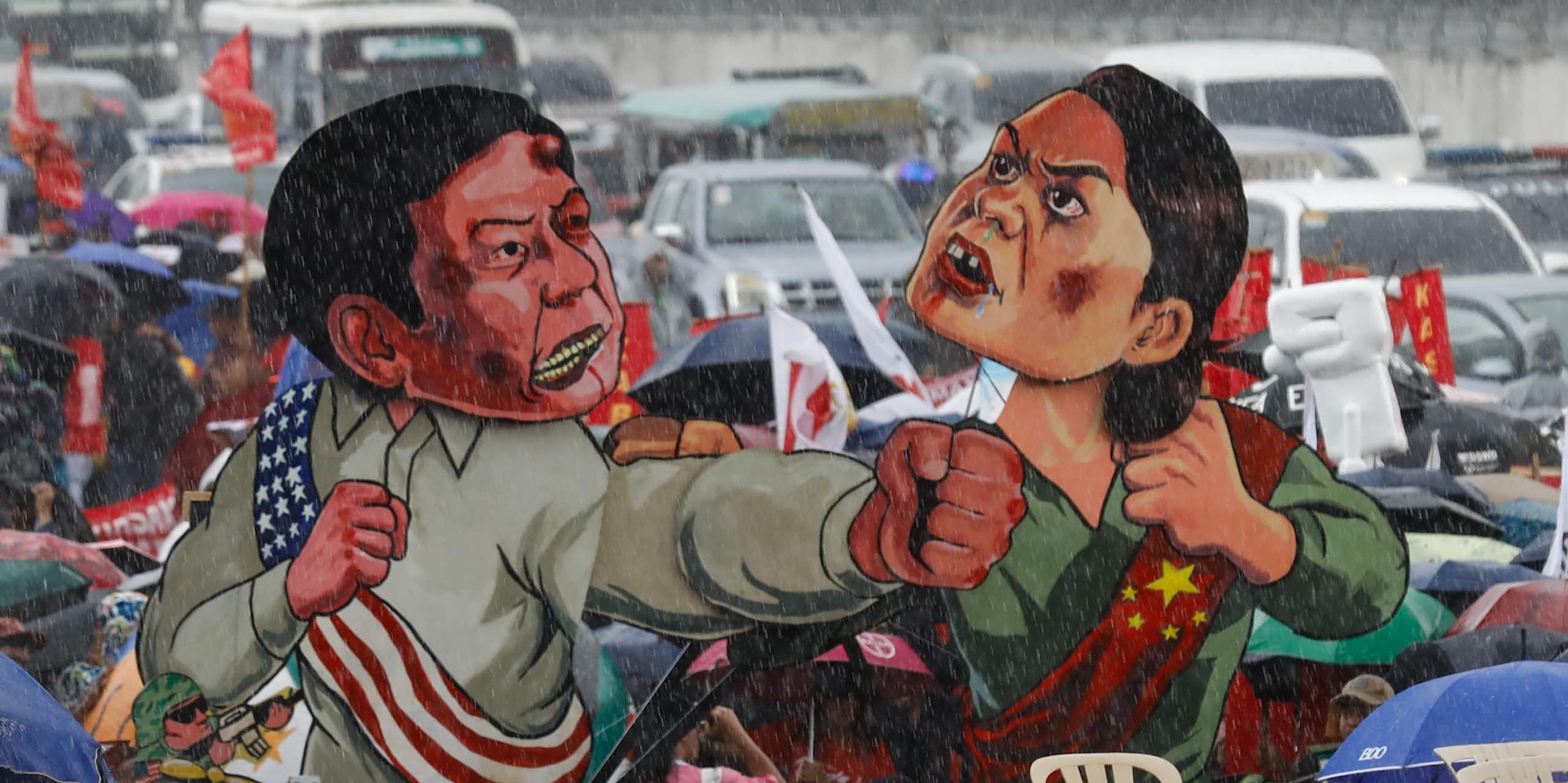 Cutouts of Ferdinand 'Bongbong' Marcos and Sara Duterte displayed during a protest in Manila, July 2024.