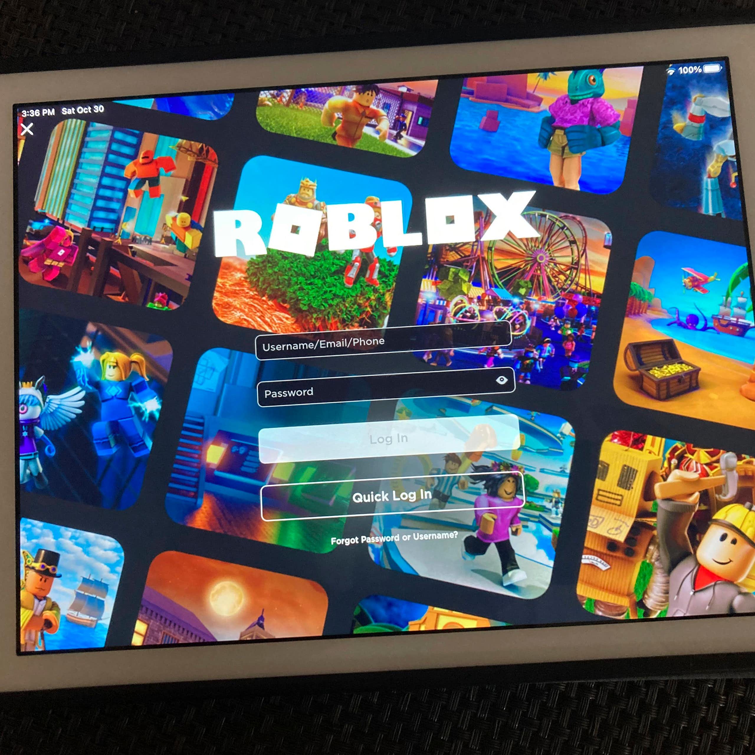 A tablet displaying the login screen for the game Roblox