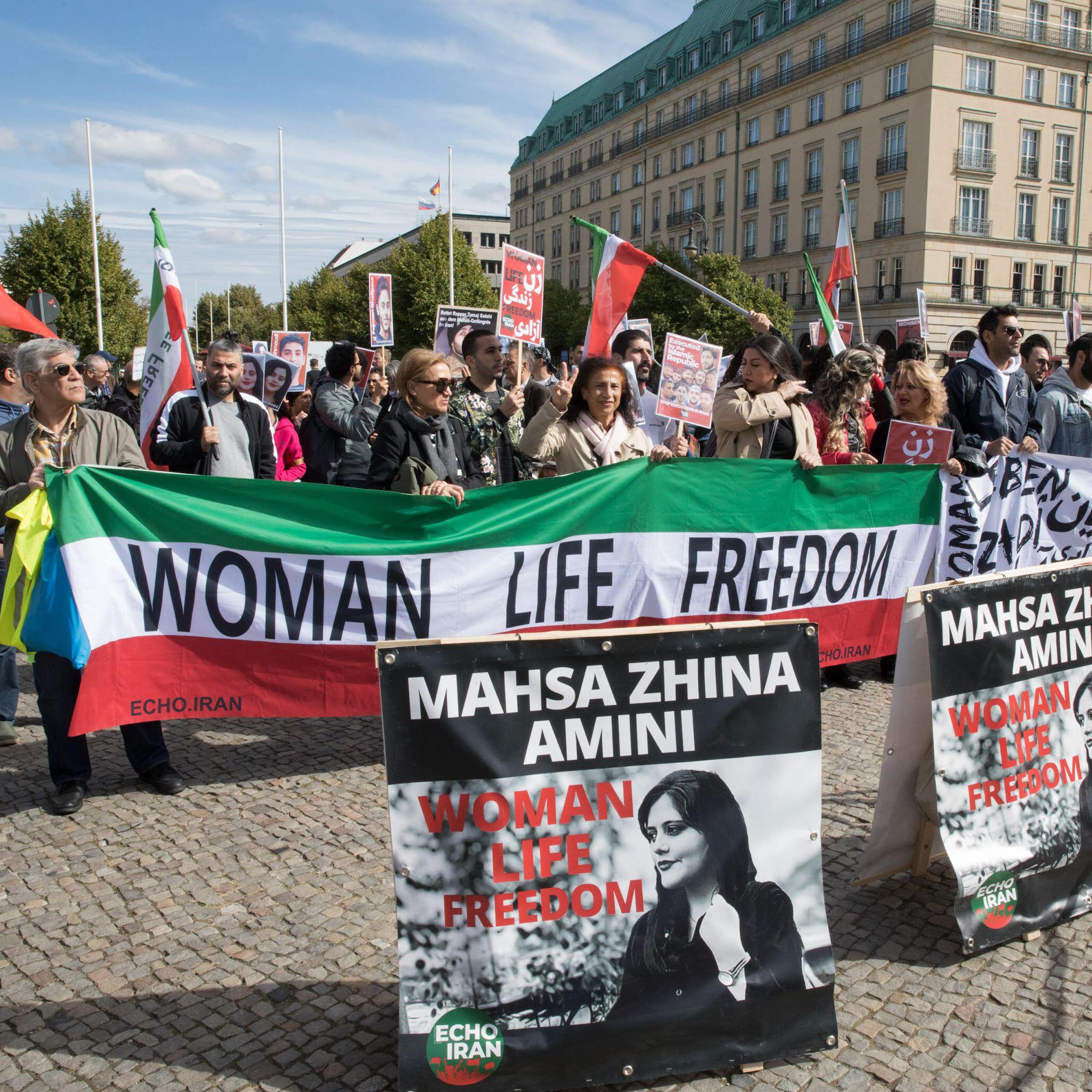 A banner saying: women, life and freedom at a protest in Berlin.