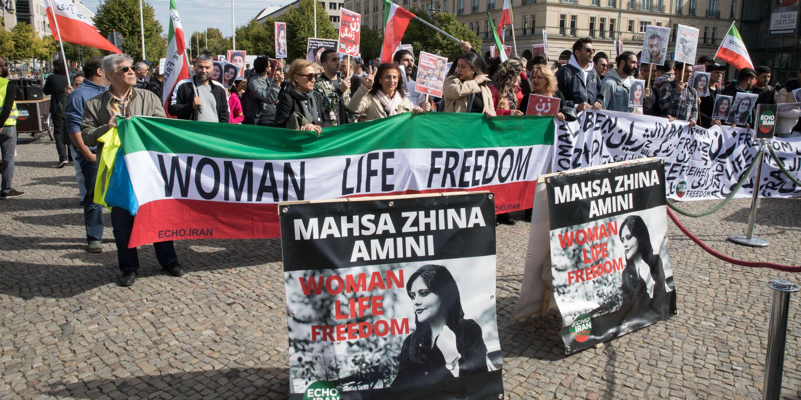 A banner saying: women, life and freedom at a protest in Berlin.