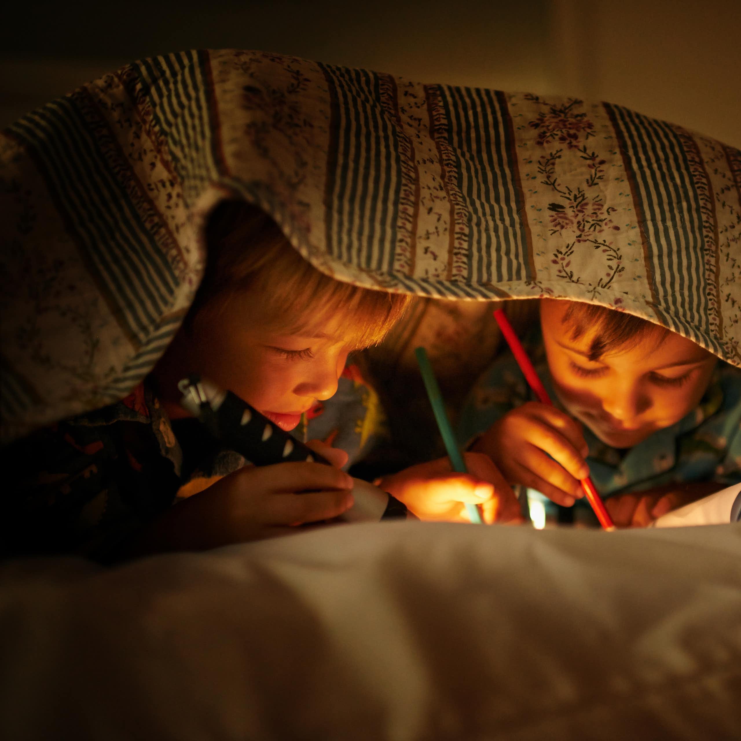 Kids colour in and draw while at a sleepover.