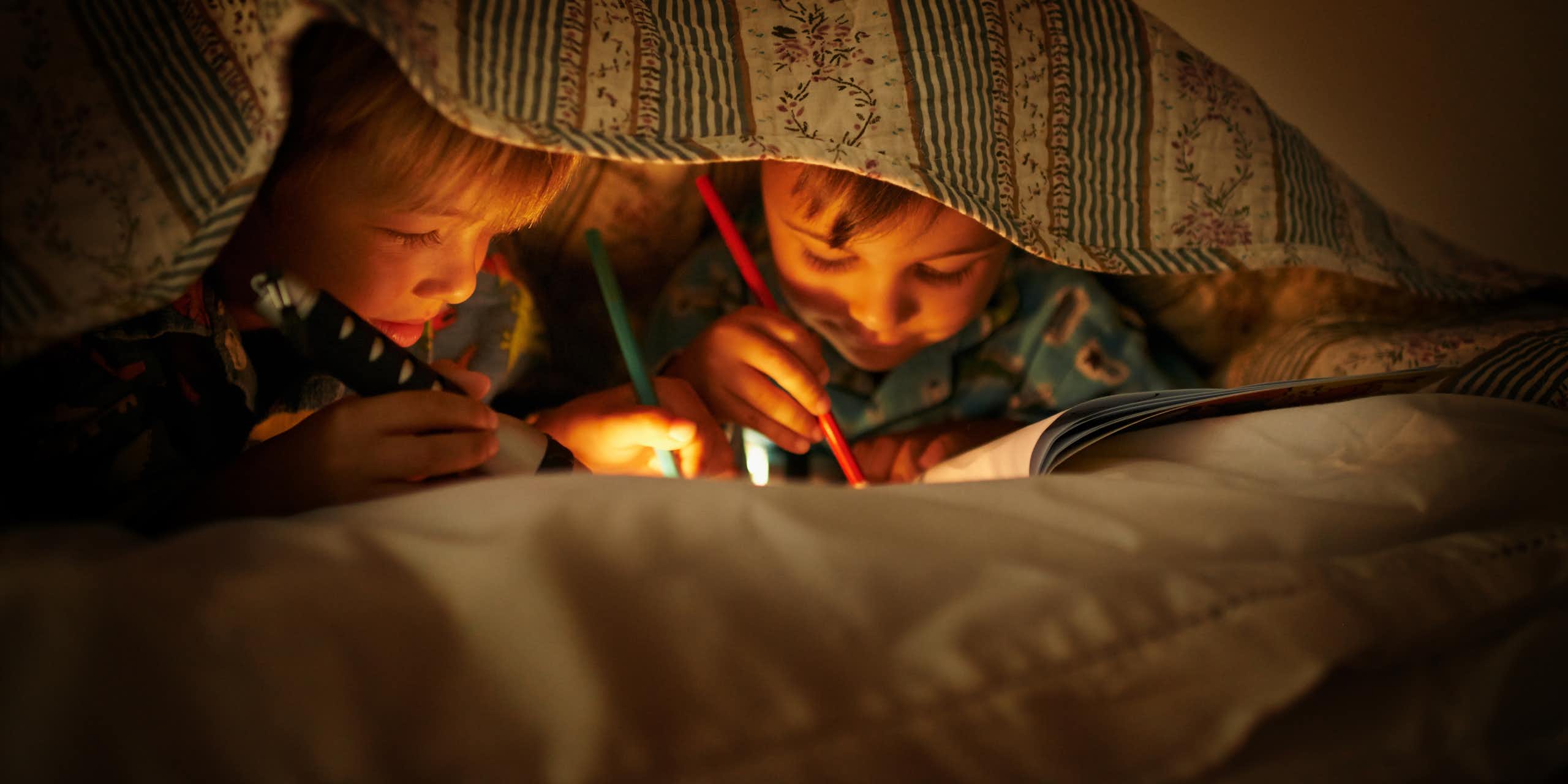 Kids colour in and draw while at a sleepover.
