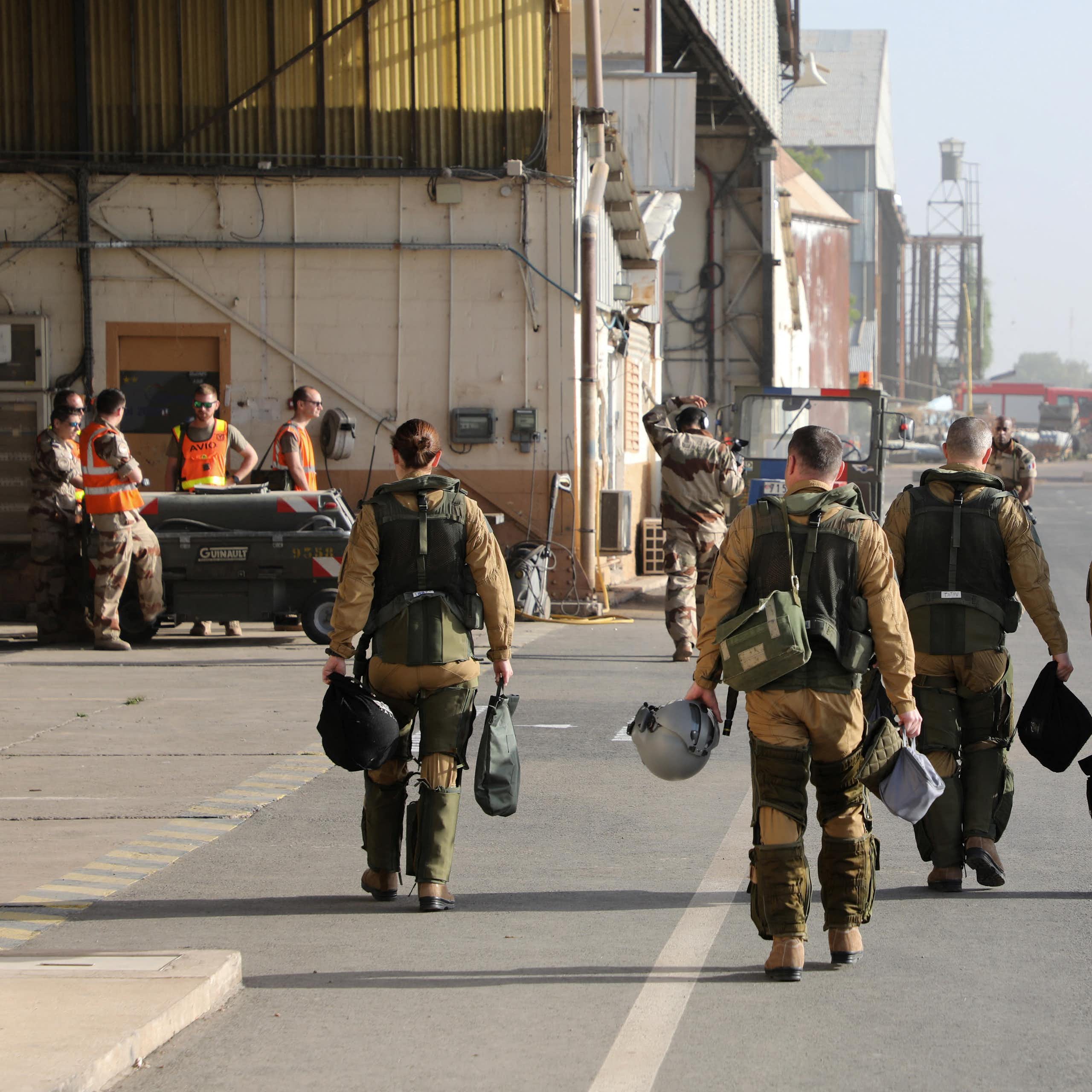 Men in military uniform at a military base